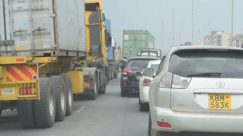 Typical rush hour traffic on Mombasa Road leading in to Nairobi Stock Footage 84075865