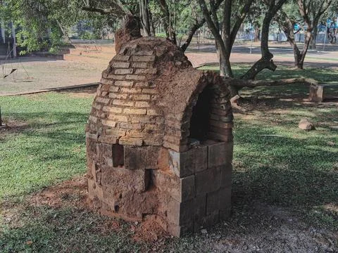 Typical rustic clay oven, set up in a park. Stock Photos