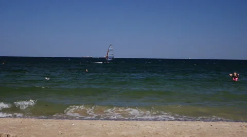 Typical scene from the beach where sea with sun reflections in the background Stock Footage 68353539