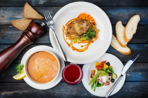 Typical set lunch. Chicken chop, pumpkin soup and vegetables salad, served with 스톡 사진