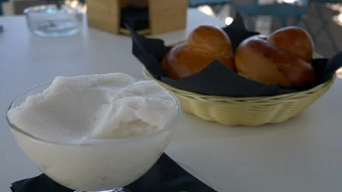 Typical Sicilian dessert. Fresh homemade brioches with an almond granita. 库存影片 166317280