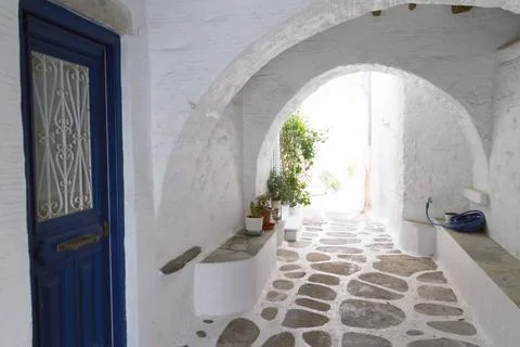 Typical small street in a Greece Classical narrow street with a painted si... Foto stock