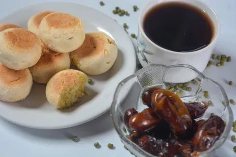 Typical snack from Java, Indonesia. Bakpia filled with nuts, black coffee a.. 库存照片