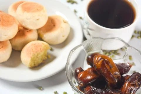 Typical snack from Java, Indonesia. Bakpia filled with nuts, black coffee a.. Stock Photos