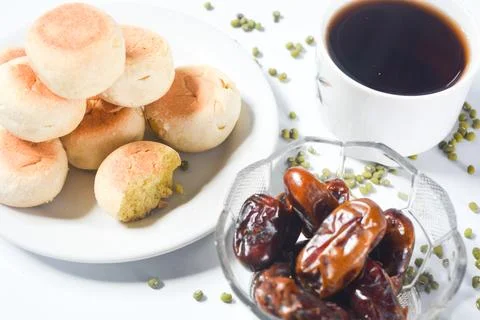 Typical snack from Java, Indonesia. Bakpia filled with nuts, black coffee a.. Stock Photos
