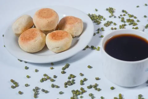 Typical snack from Java, Indonesia. Bakpia filled with nuts, black coffee a.. Fotos de archivo
