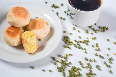 Typical snack from Java, Indonesia. Bakpia filled with nuts, black coffee a.. 스톡 사진