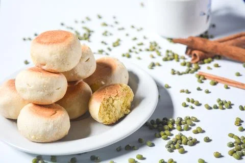 Typical snack from Java, Indonesia. Bakpia filled with nuts, black coffee a.. Stock Photos