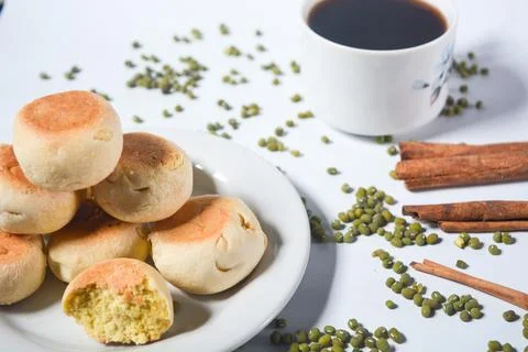Typical snack from Java, Indonesia. Bakpia filled with nuts, black coffee a.. Stock Photos