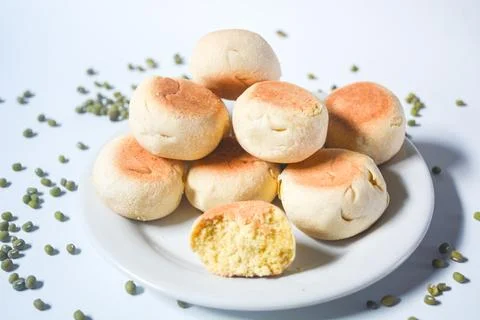 Typical snack from Java, Indonesia. Bakpia filled with nuts, black coffee a.. Stock Photos