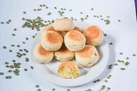 Typical snack from Java, Indonesia. Bakpia filled with nuts, black coffee a.. Stock-Fotos