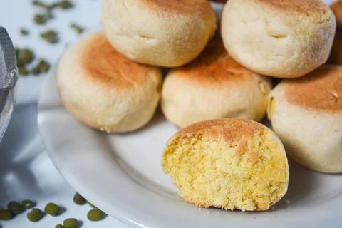 Typical snack from Java, Indonesia. Bakpia filled with nuts, black coffee a.. Stock Photos