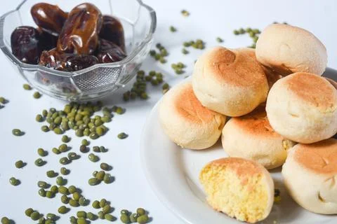 Typical snack from Java, Indonesia. Bakpia filled with nuts, black coffee a.. Stock-Fotos