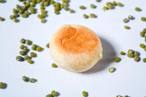 Typical snack from Java, Indonesia. Bakpia filled with nuts, black coffee a.. Stock Photos