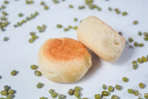 Typical snack from Java, Indonesia. Bakpia filled with nuts, black coffee a.. Stock Photos