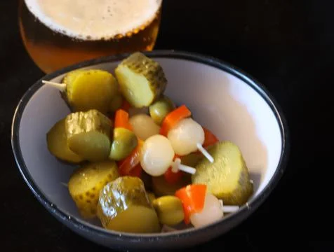Typical Spanish aperitif accompany pickle beer olives pepper Stock Photos