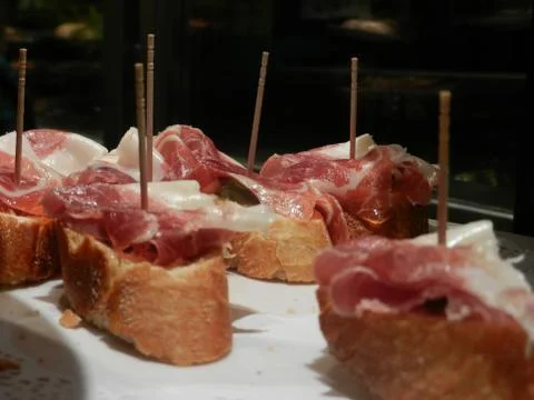 Typical spanish appetizer made of bread and ham Stock Photos