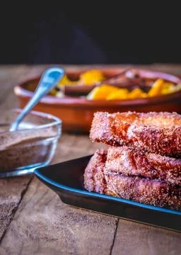 Typical Spanish food at the Easter festivities Torrijas whit sugar. Stock Photos