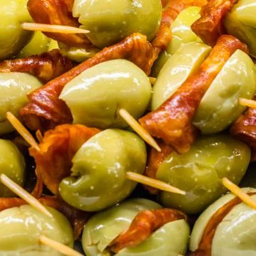 Typical Spanish olive tapas in a bar Stock Photos