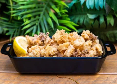 Typical Spanish portion of fried squid Stock Photos