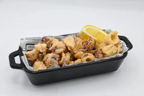 Typical Spanish portion of fried squid Stock Photos