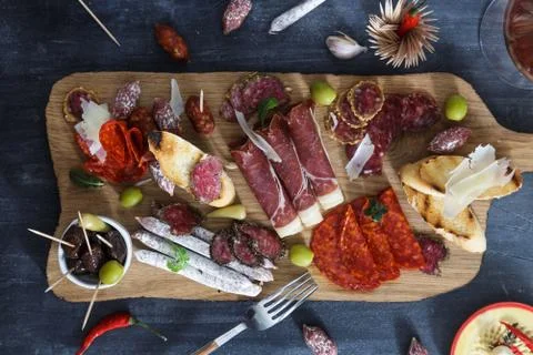 Typical spanish tapas concept. include variety slices jamon, chorizo, salami Stock Photos
