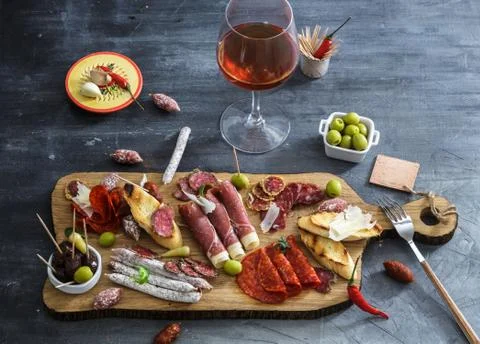 Typical spanish tapas concept. include variety slices jamon, chorizo, salami Stock Photos