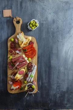 Typical spanish tapas concept. include variety slices jamon, chorizo, salami Stock Photos