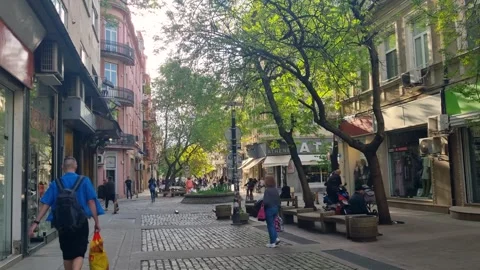 A typical spring day in Sofia’s Serdika pedestrian zone, where people stroll Video stock 312671270