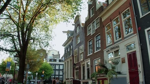 Typical street view in Amsterdam city center in the canal district Stock Footage