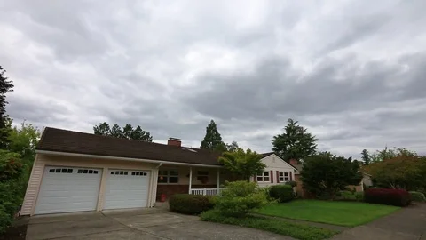 Typical suburb home cloudy day Stock Footage 73218750