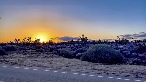 Typical sunset in the Mojave Desert, which is the largest and hottest desert Stock Photos