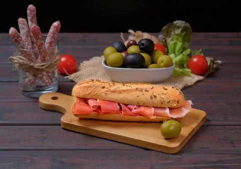 Typical tapas, snacks and appetizers, Spanish ham sandwich . Stock Photos