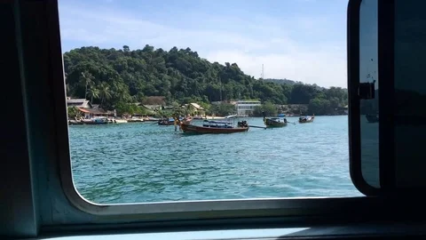 Typical Thai boat passes in the window Stock Footage 92423591