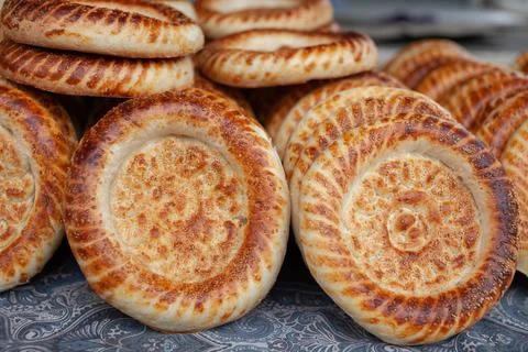 Typical traditional flatbread with crunchy crust with sesam just baked Stock Photos