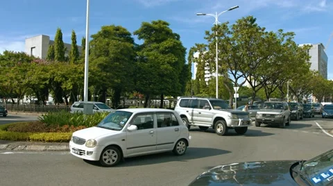 Typical traffic, negotiating a traffic circle in Kota Kinabalu. Video 4k Stock Footage 59846616