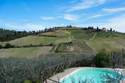 Typical Tuscan scenery with wineries, olive trees, and rolling hills Stock Photos