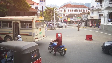 Typical urban intersection with heavy traffic and sound, in Kandy. Stock Footage 84430412