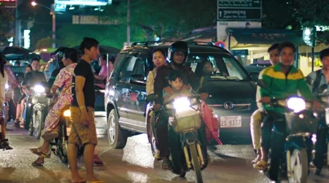Typical urban traffic in the evening in Siem Reap, with sound. Video stock 63573775