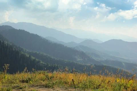 A typical view of a hiker in the mountains of Central Asia. Domestic tourism in Stock Photos