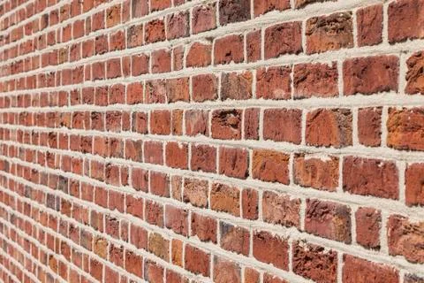 Typical wall with red bricks. Stock Photos