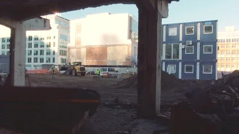Typical work at the construction site. Tractor digs a pit for building Stock Footage 83381581