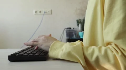 Typing action captured from low angle, showing only arms and keyboard, idea.. Stock Footage 315517356