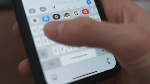 Typing and deleting message on iPhone then type again and send: hello [6K30] Stock-Footage 127634369
