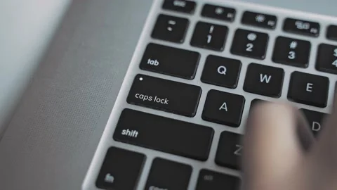 Typing and presses Caps Lock key Stock Footage 171858068