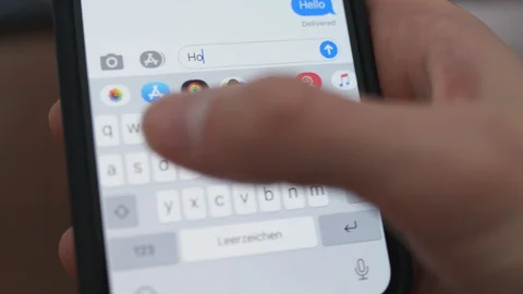 Typing and sending message on iPhone: how are you? [6K30] Stock-Footage 127634305