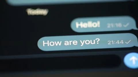 Typing and sends the message hello, how are you. Let's meet tonight. Stock Footage 136048202