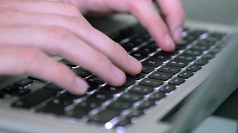 Typing on an apple Laptop Stock Footage 39993833