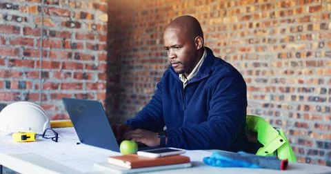 Typing, architect and black man with laptop for construction project, build.. Fotos Stock