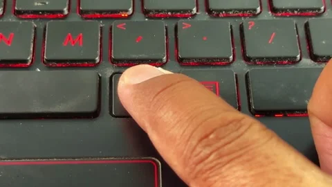 Typing on backlit "alt" button laptop keyboard in macro view, Stock Footage 336357537
